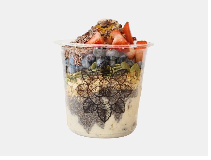 E+ROSE SoBro bowl — berries, granola, and coconut yogurt in a lotus-print cup